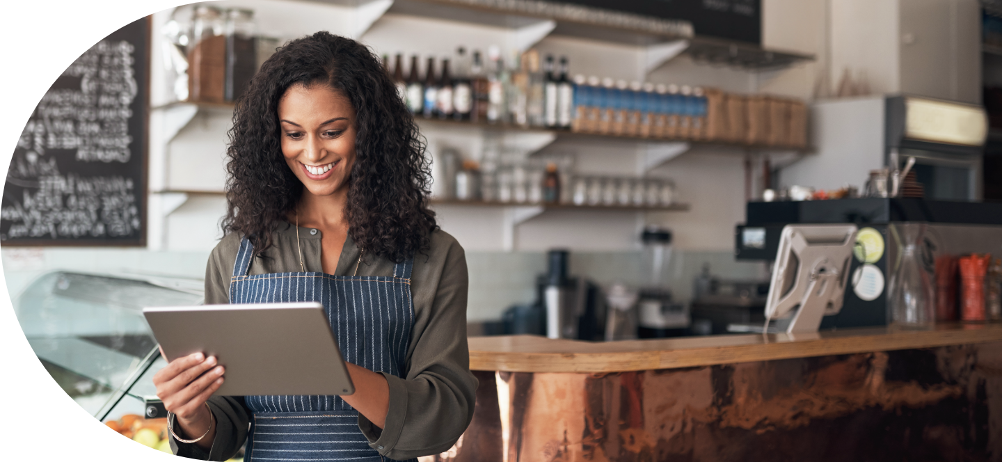 Girl in restaurant looking at ipad